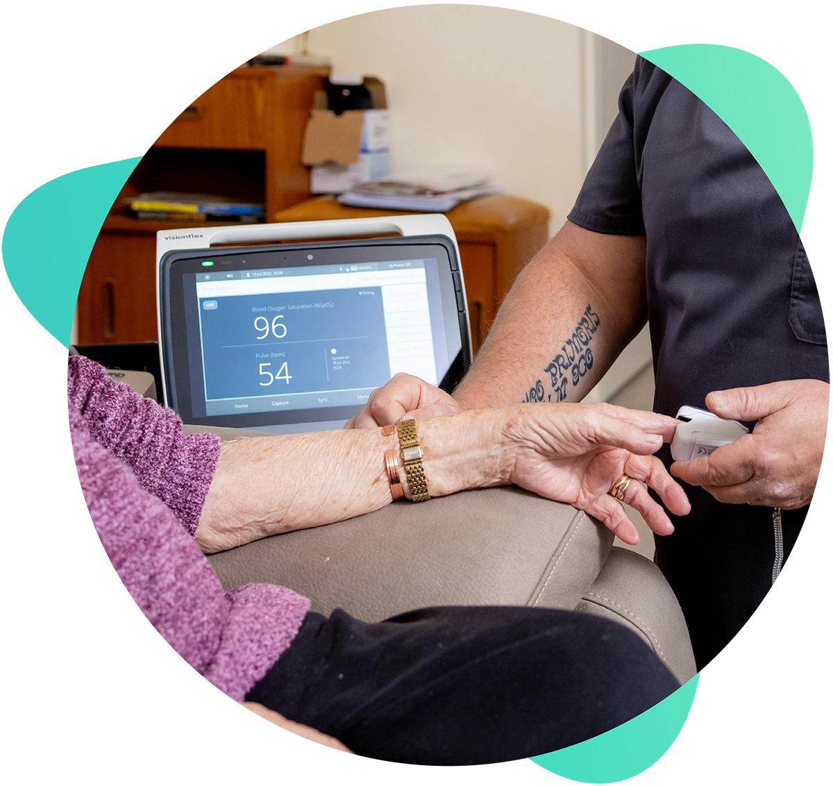 Photo of healthcare professional using a pulse oximeter and a ProEX Mobile device on a patient Photo of healthcare professional using a pulse oximeter and a ProEX Mobile device on a patient